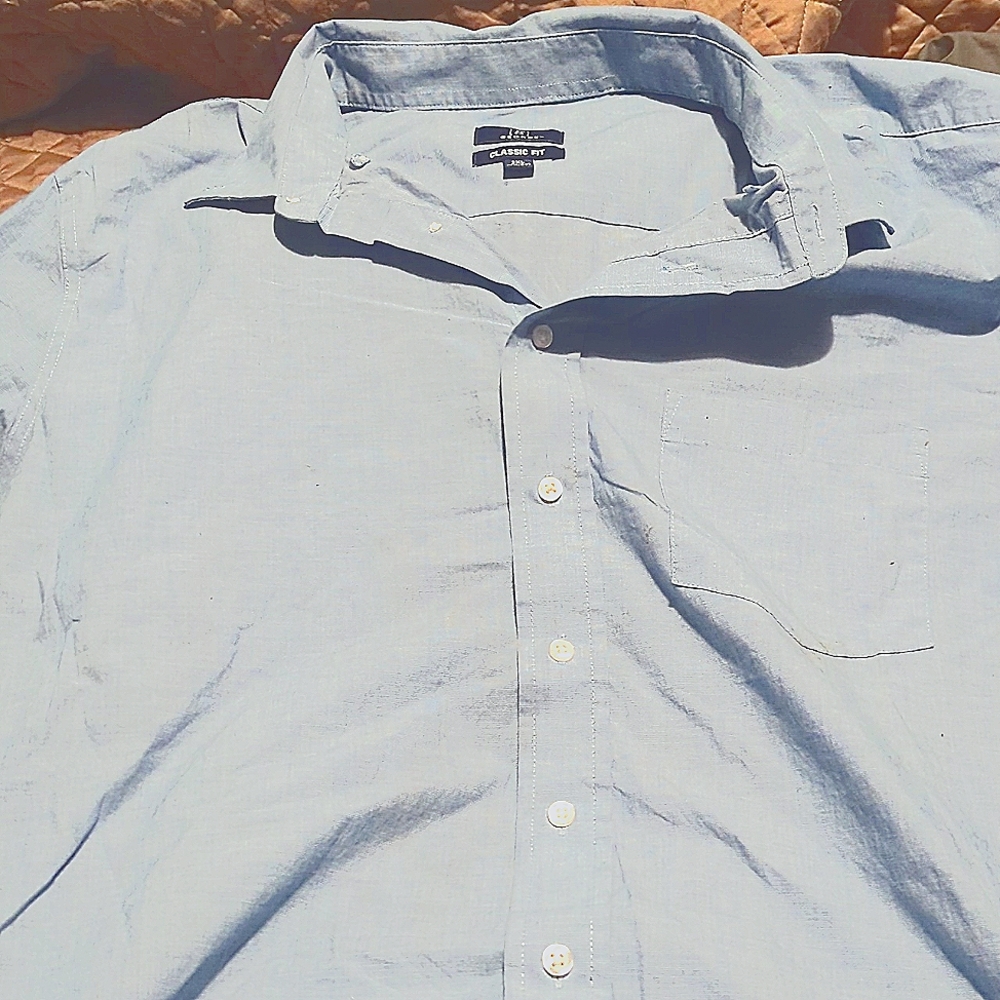 A very gently used baby blue long sleeved button up dress shirt 2xl George